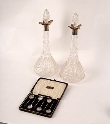 Appraisal: A pair of Edwardian silver mounted glass decanters and stoppers