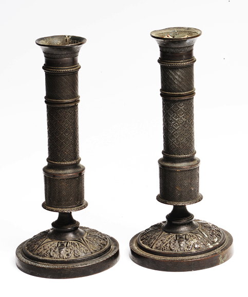 Appraisal: A PAIR OF TH CENTURY BRONZE CANDLESTICKS of column form