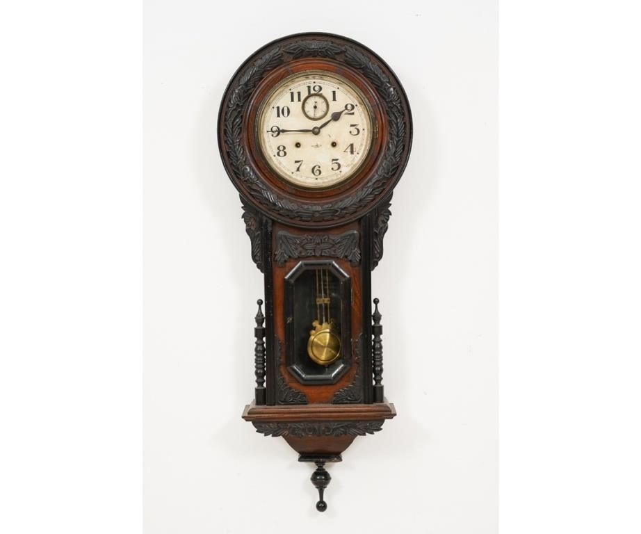 Appraisal: Spring-driven carved mahogany wall clock with Arabic numerals h x