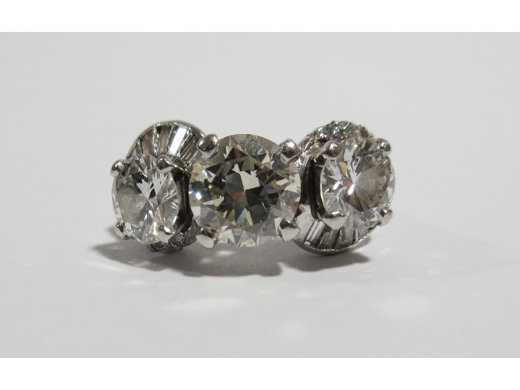 Appraisal: An impressive platinum diamond three stone cocktail ring the central