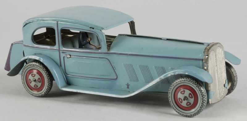 Appraisal: Tin Litho Wells Sedan Automobile Wind-Up Toy Description Marked Made