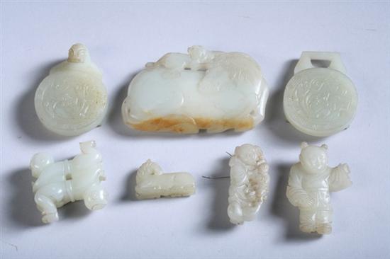 Appraisal: SIX CELADON JADE CARVINGS Two belt buckles horse-form pendant figure