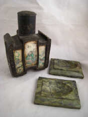 Appraisal: A Chinese pewter tea caddy with vignettes under glass panels