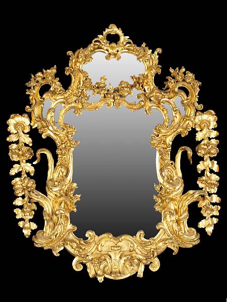 Appraisal: A robust Italian Baroque style giltwood mirror th th century