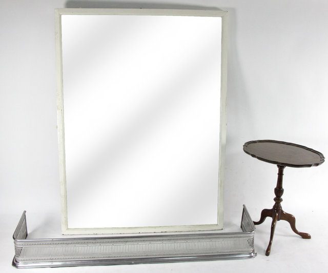 Appraisal: A burnished steel fender a white painted wall mirror a