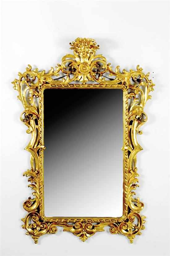 Appraisal: Giltwood Rococo style mirror early th century scrolling carved foliate