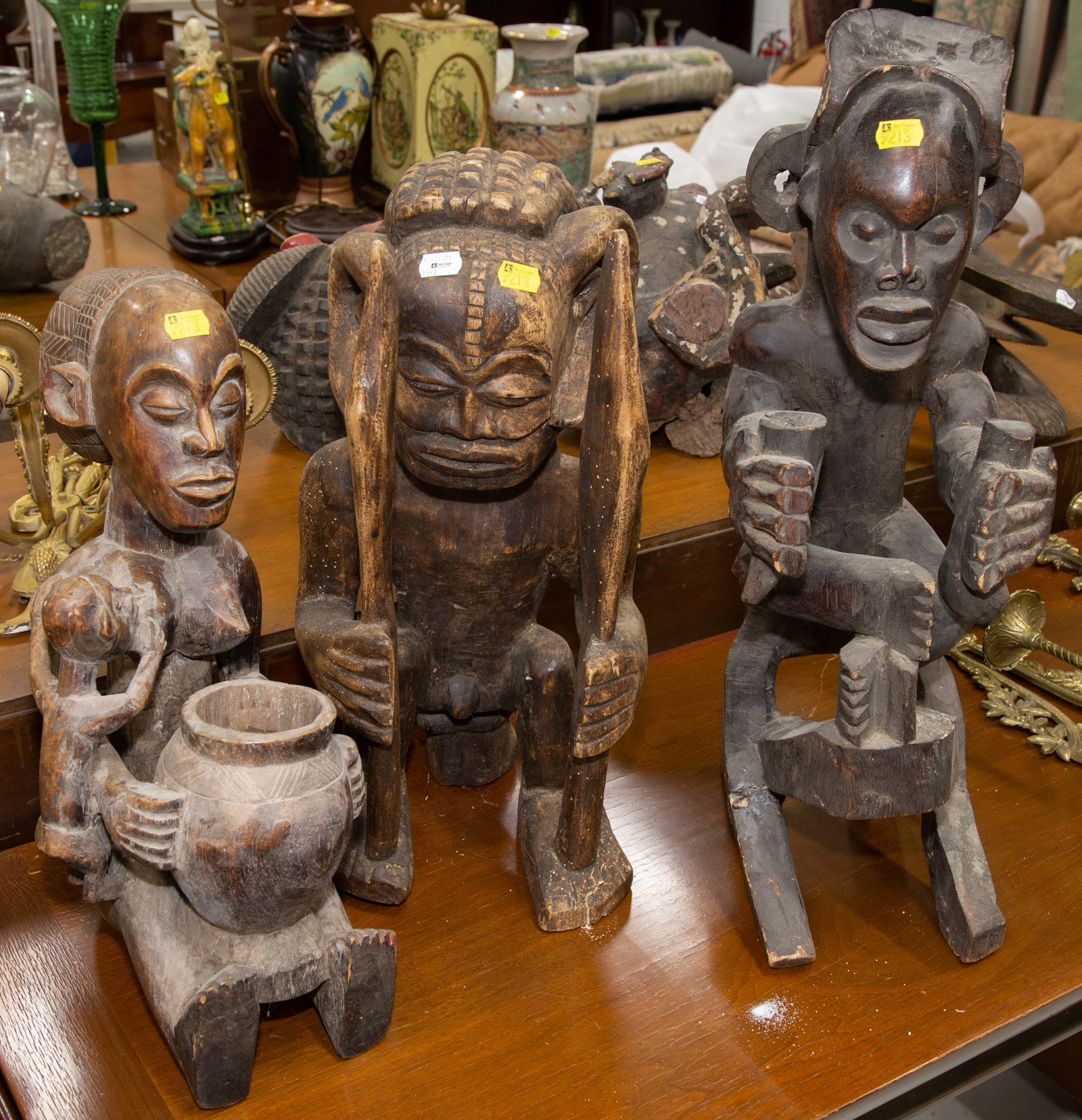 Appraisal: THREE AFRICAN CARVED FIGURES All th century including a Luba