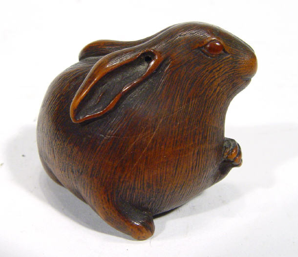 Appraisal: Oriental carved hardwood Netsuke in the form of a rabbit