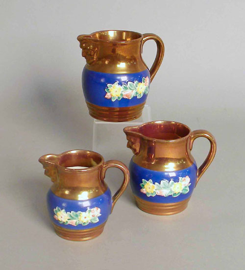 Appraisal: Graduated set of three copper luster creamers h h and