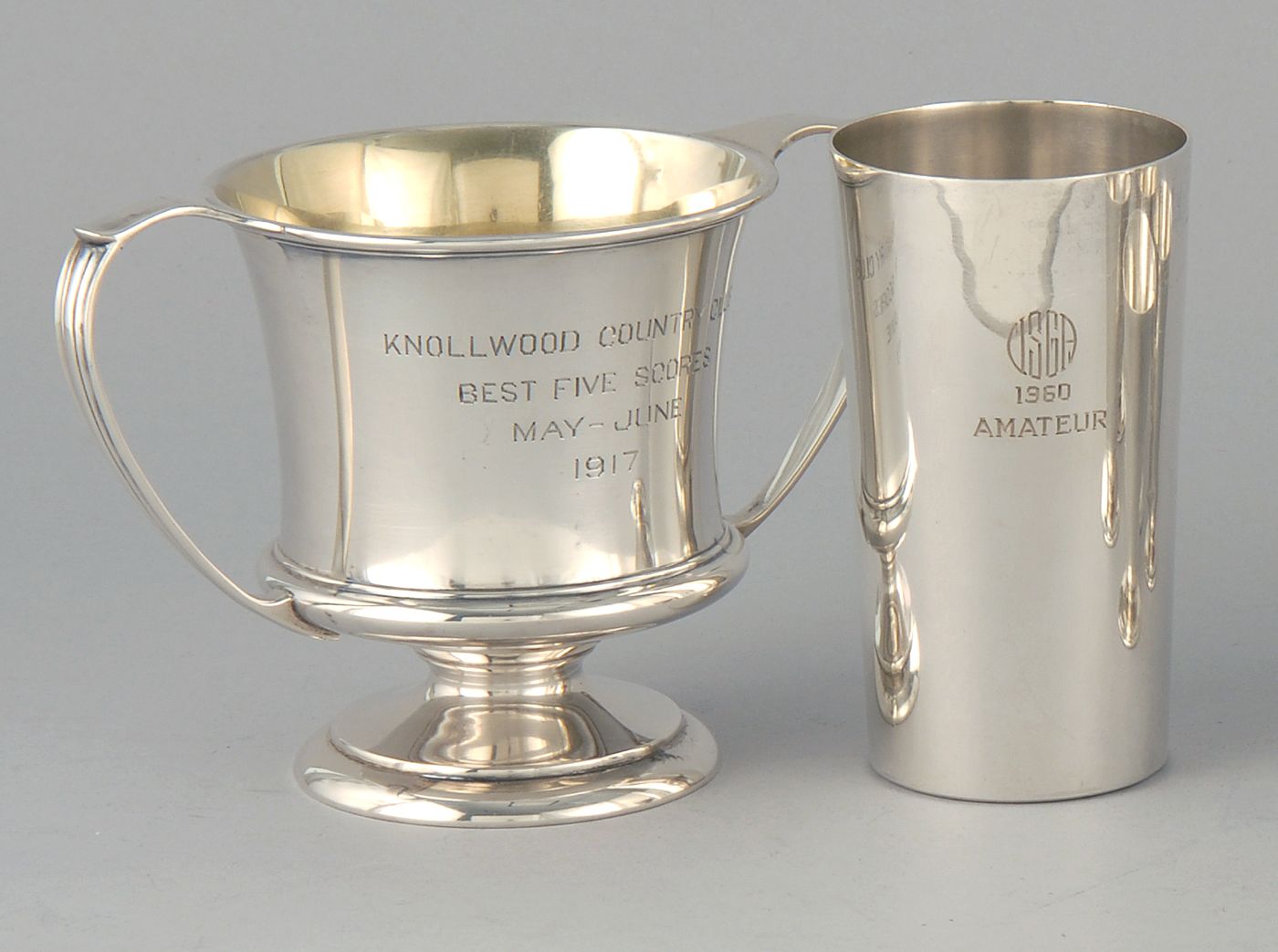 Appraisal: TWO STERLING SILVER GOLF TROPHY CUPS A two-handled loving cup