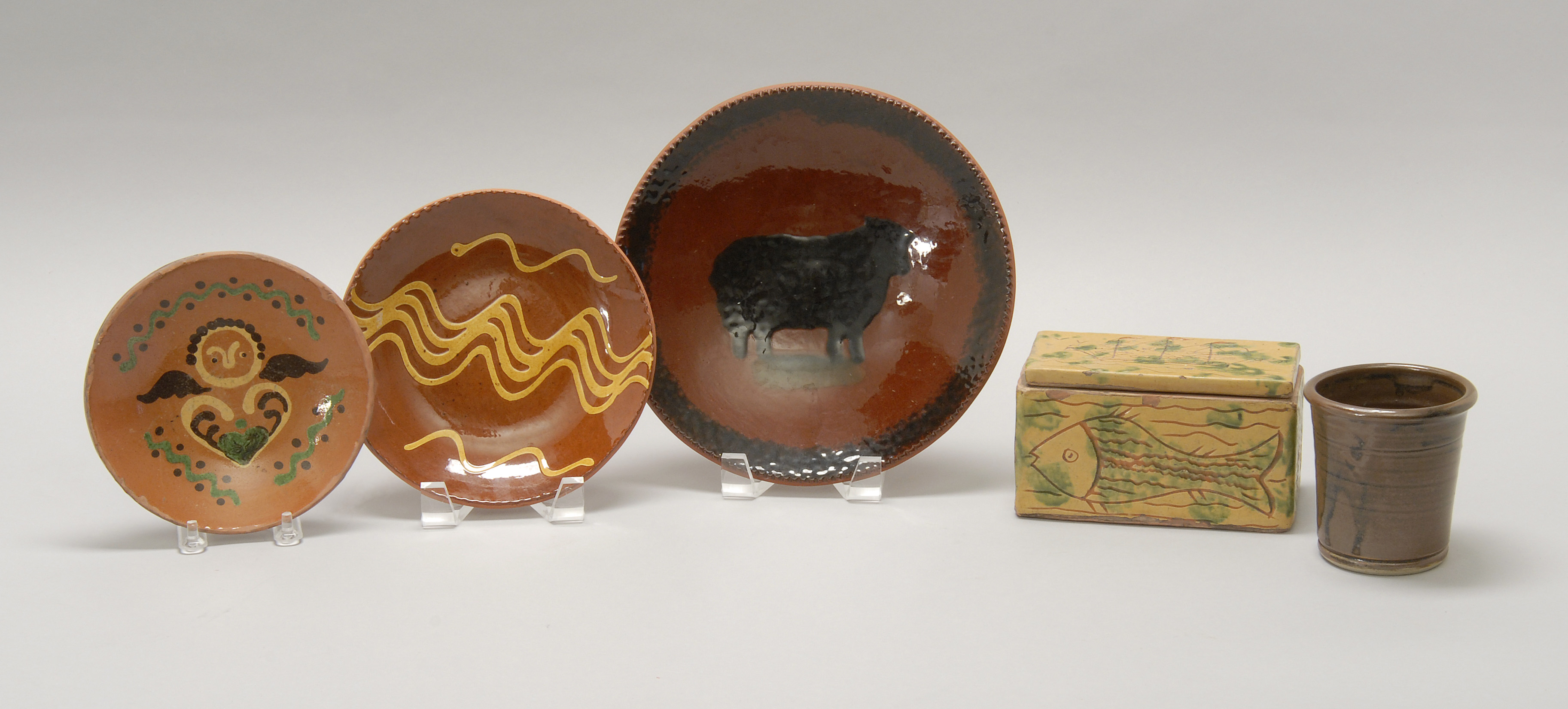 Appraisal: FIVE CONTEMPORARY REDWARE ITEMS a covered box with ship and