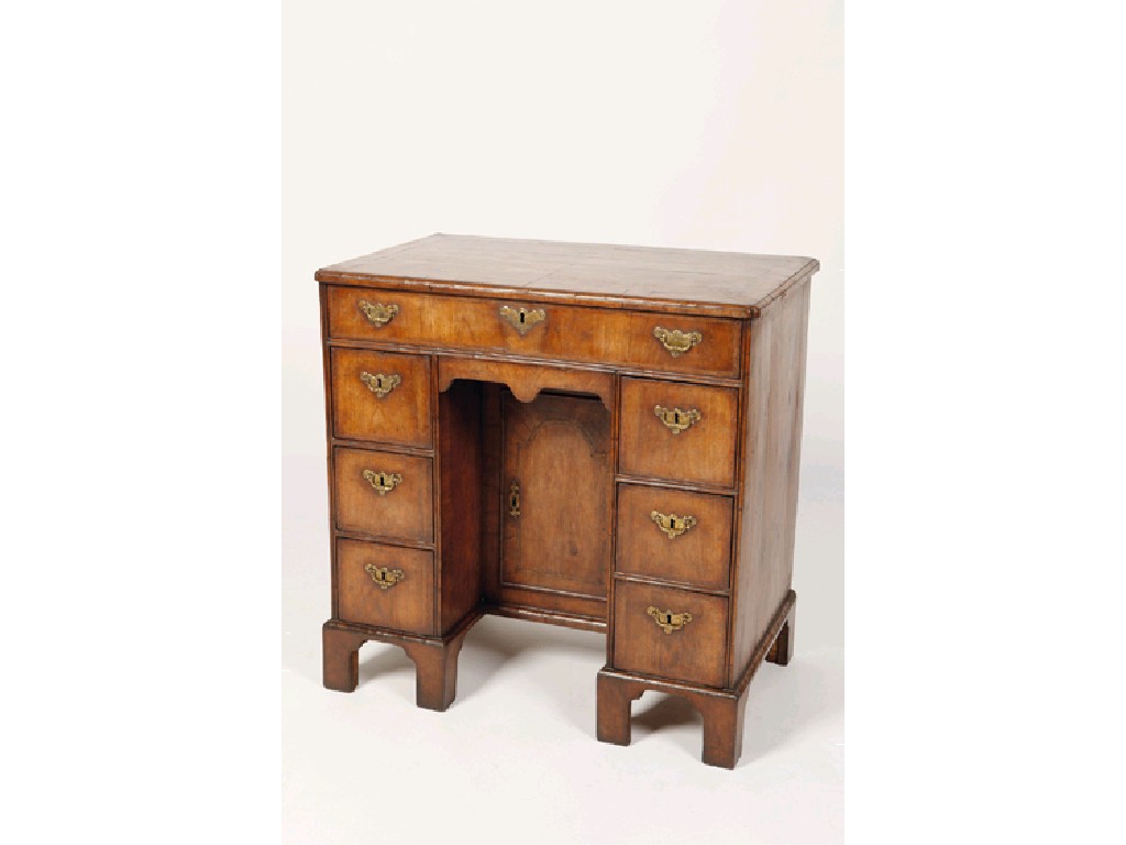 Appraisal: A QUEEN ANNE WALNUT KNEEHOLE WRITING DESK the rectangular top