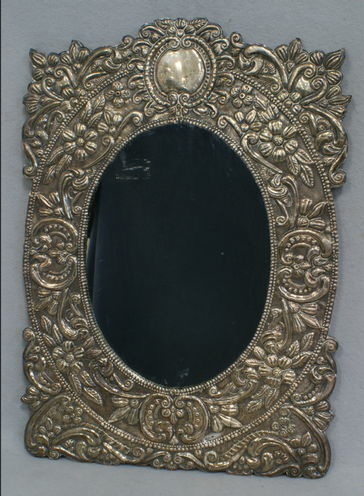 Appraisal: silver floral repousse wall mirror on a hardwood backing signed