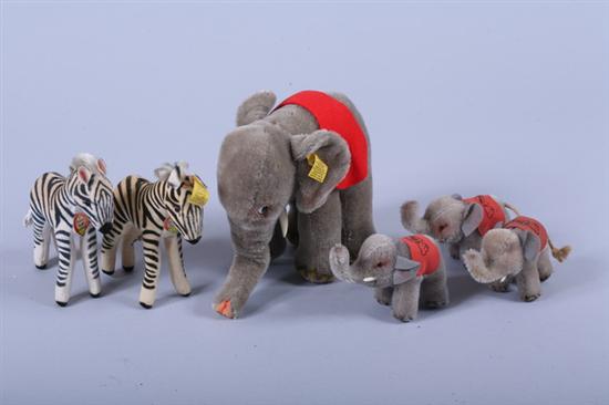 Appraisal: FOUR STEIFF ELEPHANTS AND TWO ZEBRAS Elephant with red felt