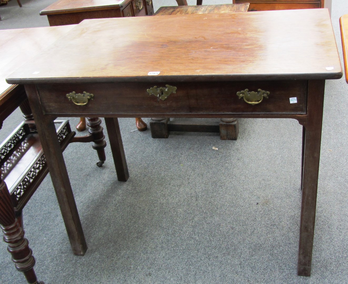 Appraisal: A mid th century single drawer side table on square