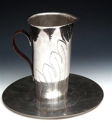 Appraisal: A CONTINENTAL POSSIBLY PORTUGUESE ART NOUVEAU SILVER METAL TAPERING JUG