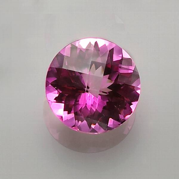 Appraisal: Pink Topaz A circular-cut stone with excellent transparency exhibiting a