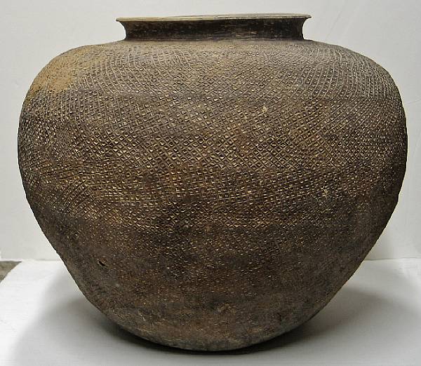 Appraisal: A high fired earthenware globular jar Warring States to Han