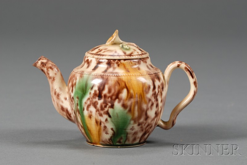 Appraisal: Staffordshire Tortoiseshell Glazed Creamware Teapot and Cover England c floral