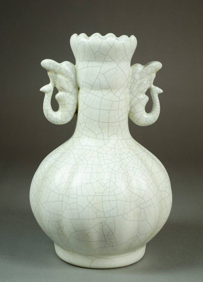 Appraisal: CHINESE GE WARE FOOTED VASE bottle form with ribbed sides