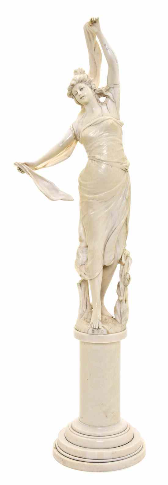 Appraisal: A Continental Art Nouveau Carved Ivory Figure depicting a robed