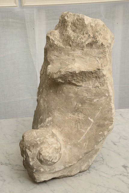 Appraisal: A MEDIEVAL CARVED LIMESTONE CROCKET FRAGMENT reputedly from Rouen Cathedral