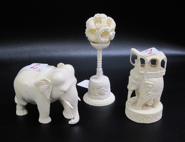 Appraisal: GROUP OF THREE CARVED IVORY SCULPTURES elephant H an elephant