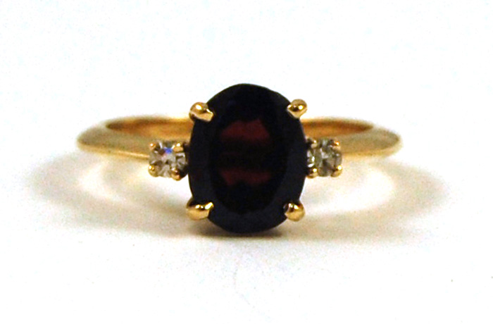 Appraisal: GARNET DIAMOND AND FOURTEEN KARAT GOLD RING set with an