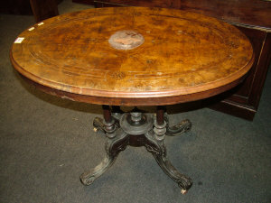 Appraisal: A walnut loo table th century the top with circular