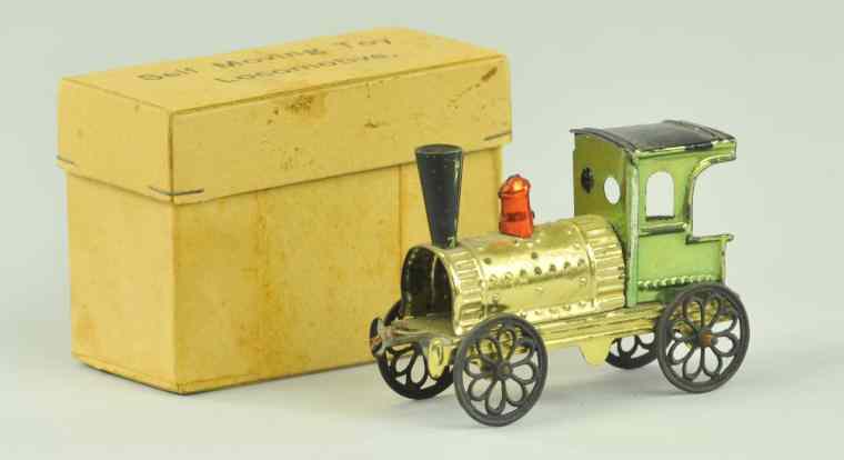 Appraisal: BOXED LOCOMOTIVE PENNY TOY Tin locomotive w ornate spoke wheels