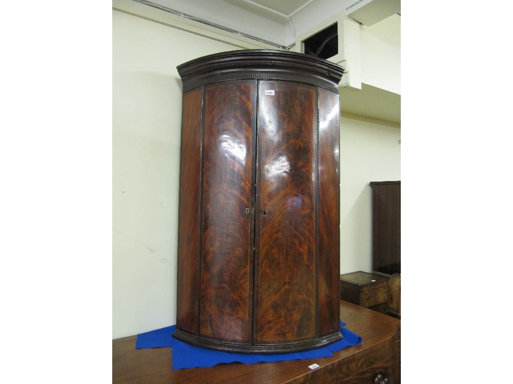 Appraisal: th century mahogany bow fronted corner cupboard