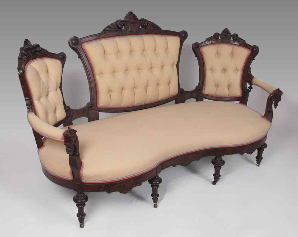 Appraisal: ROCOCO REVIVAL VICTORIAN SOFA Carved section back padded armrests carved