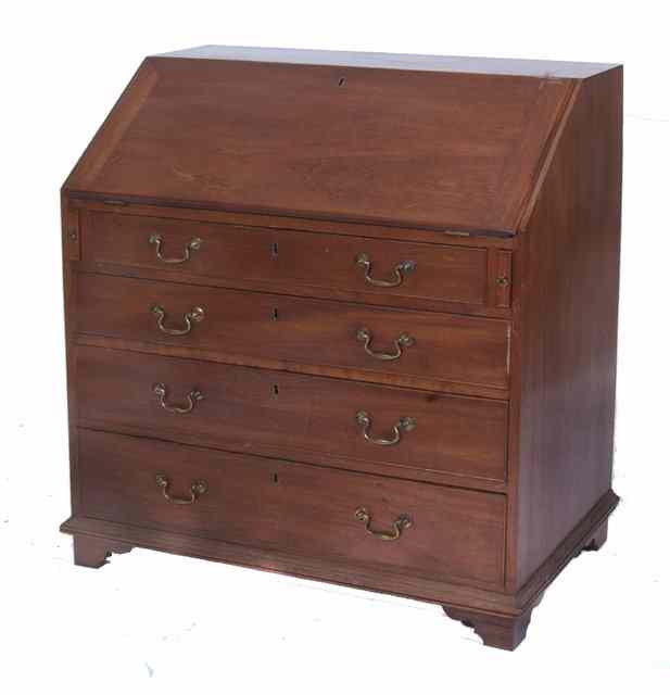 Appraisal: A TH CENTURY MAHOGANY BUREAU the fall front enclosing a