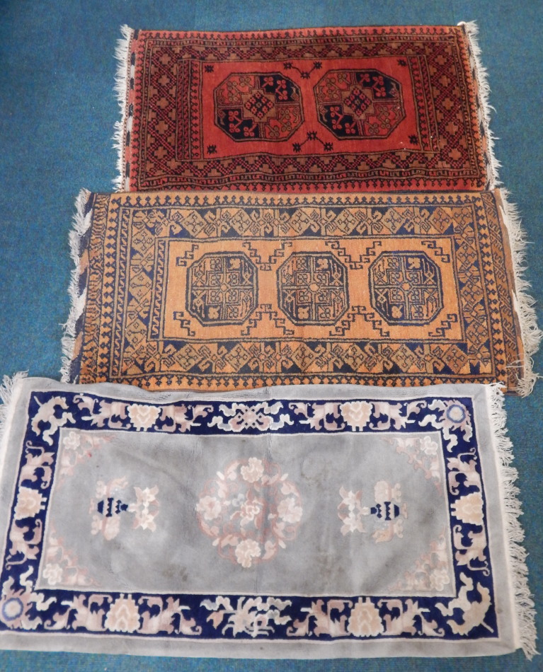 Appraisal: Two Afghan rugs each with a design of medallions on