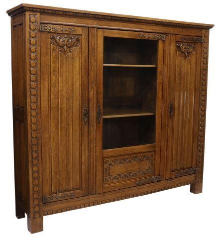 Appraisal: French Gothic style oak vitrine bookcase th c lunette molded