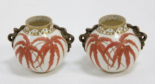 Appraisal: A pair of Grainger's Worcester globular jars with pierced rims