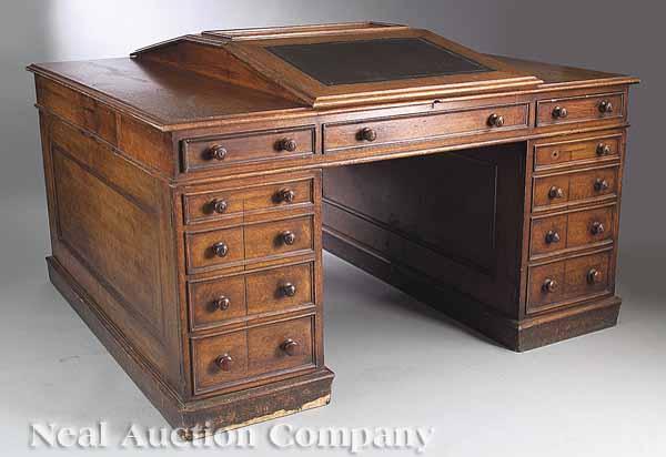 Appraisal: An Edwardian Oak Partner's Desk c the molded top with