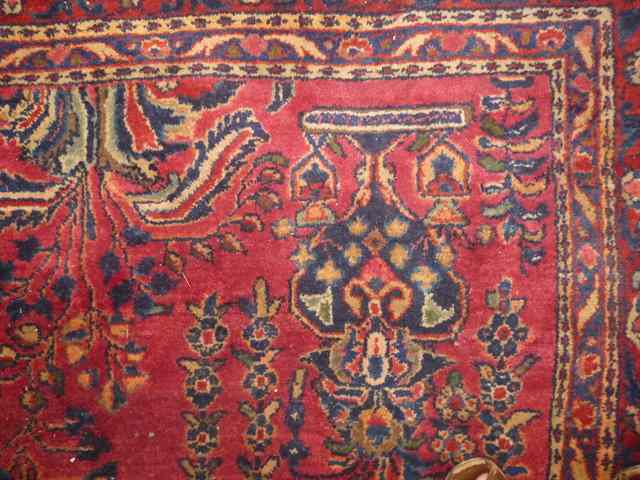 Appraisal: A PERSIAN RED GROUND CARPET with all over foliate design