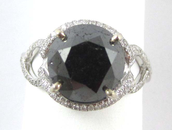 Appraisal: BLACK DIAMOND AND FOURTEEN KARAT WHITE GOLD RING centering a