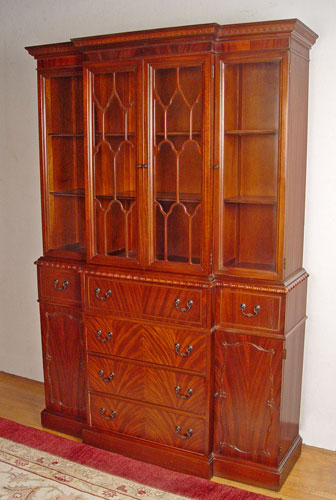 Appraisal: FLAME GRAIN MAHOGANY BREAKFRONT SECRETARY CHINA CABINET Lower case with