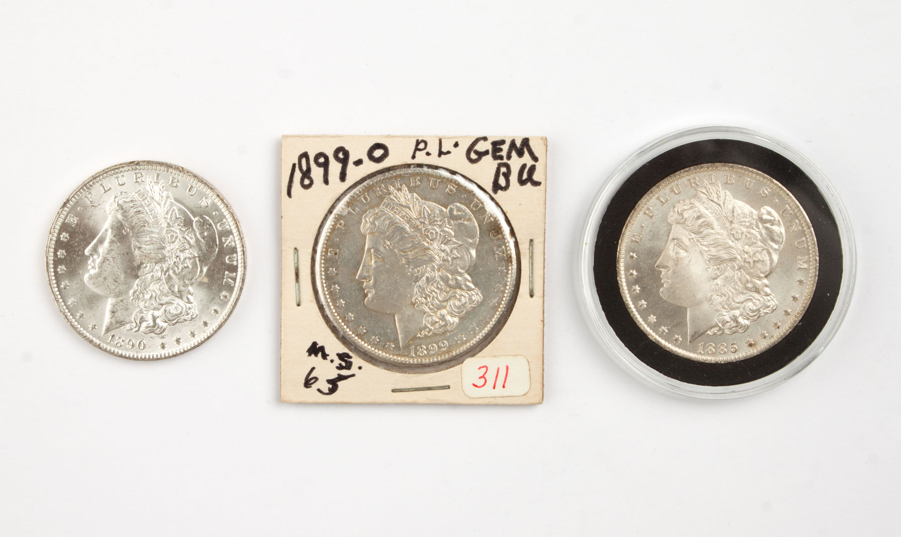 Appraisal: Three U S Morgan type silver dollars - comprising -O