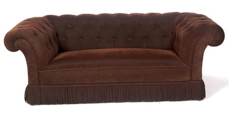 Appraisal: A late Victorian brown Chesterfield sofa the scroll button back