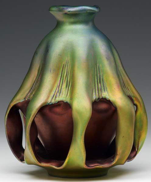 Appraisal: ZSOLNAY Organically-shaped vase with eight reticulated handles covered in lustered