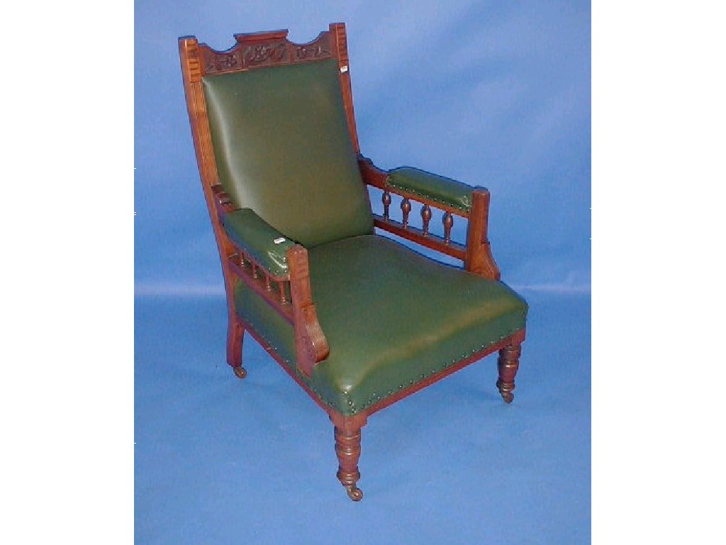 Appraisal: A late Victorian walnut galleried armchair with green faux leather