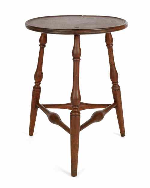 Appraisal: Pennsylvania Windsor walnut candlestand ca with a dished top and