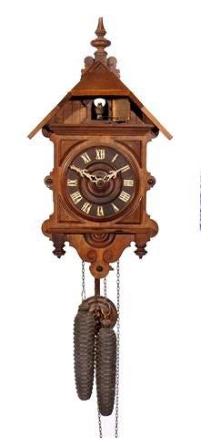 Appraisal: A Swiss walnut cased cuckoo wall clock of Swiss chalet