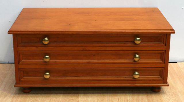 Appraisal: A pine coffee table with three long drawers cms wide