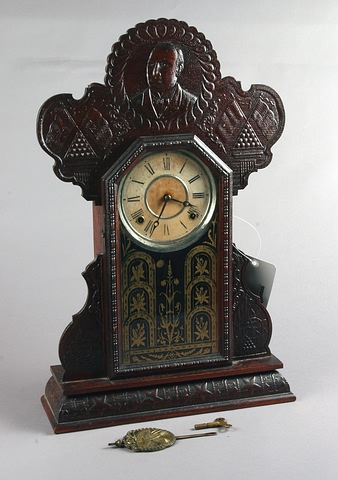 Appraisal: E Ingraham Oak Mantel clock Spanish-American War theme day time