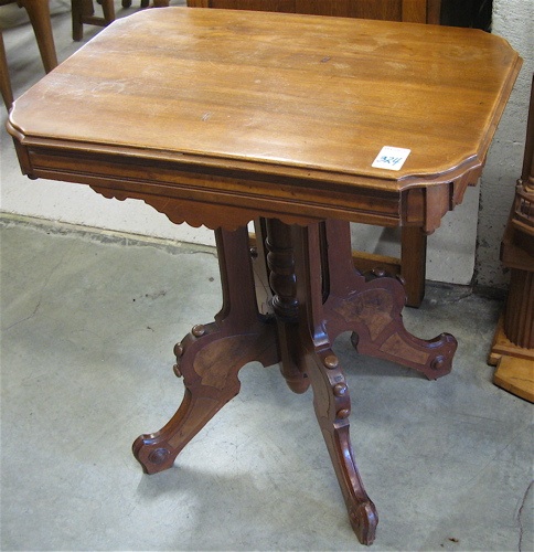 Appraisal: VICTORIAN WALNUT LAMP TABLE Eastlake design American last quarter of