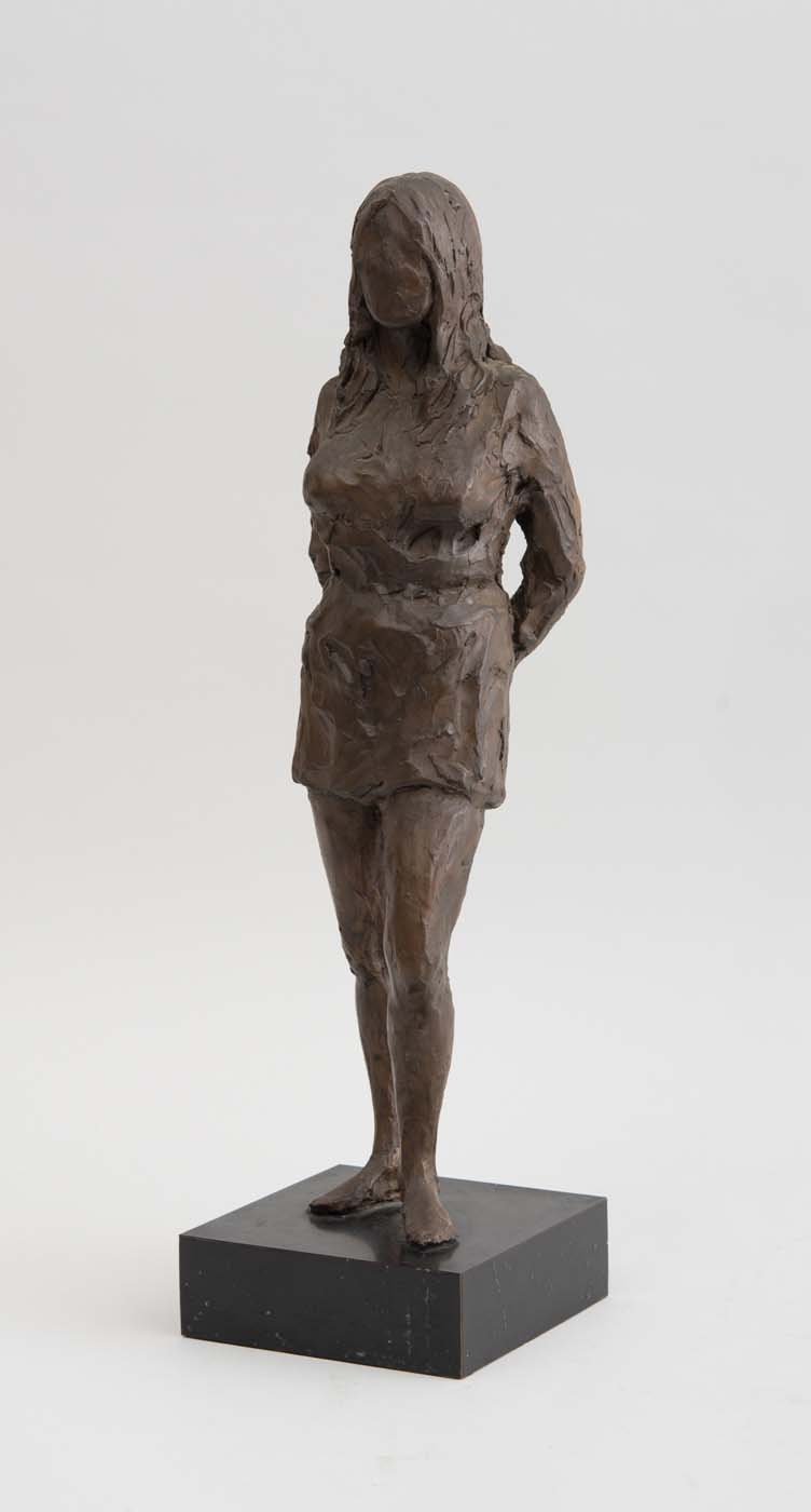 Appraisal: TH CENTURY SCHOOL STANDING FEMALE FIGURE Bronze-patinated plaster unmarked on